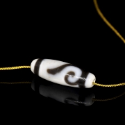 Carved agate dzi “Spiral,” Tang dynasty
