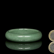 Rigid green jade bangle, 20th century