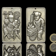 Pair of silver metal plaques, ‘Characters’, 20th century