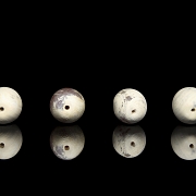 Four large carved stone beads, Qing dynasty