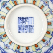Porcelain bowl with doucai enamels, ‘Flowers’, with Qianlong seal