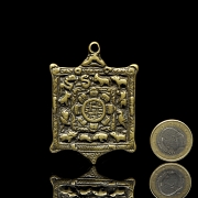 Amuleto de bronce