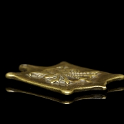 Amuleto de bronce