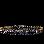 Yellow gold rivière bracelet with tanzanites