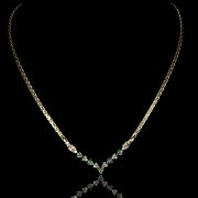 Gargantilla de oro amarillo con esmeraldas y diamantes