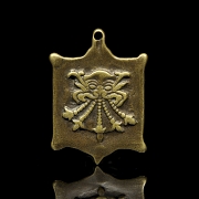 Amuleto de bronce