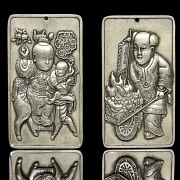 Pair of silver metal plaques, ‘Characters’, 20th century