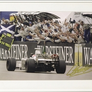 Photograph signed by Johnny Herbert celebrating victory, 1999 - 1