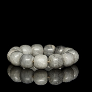Bracelet with thirteen greyish jade beads, 20th century