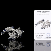 Broche con zafiros y diamantes en oro blanco de 18 kt