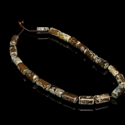 Necklace with twenty carved stone beads, Han style.