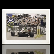 Photograph signed by Johnny Herbert celebrating victory, 1999