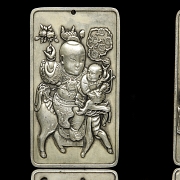 Pair of silver metal plaques, ‘Characters’, 20th century