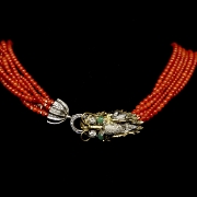 Gold necklace with diamonds and coral beads