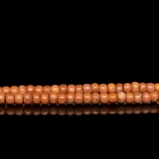 Bag with 180 coral-coloured beads, 20th century