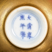 Pair of gold-coloured porcelain cups, marked Kangxi