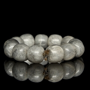 Bracelet with thirteen greyish jade beads, 20th century