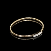Pulsera rígida de oro amarillo de 18 kt con diamantes