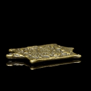 Amuleto de bronce