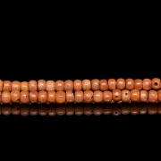 Bag with 180 coral-coloured beads, 20th century