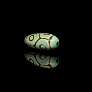 Cuenta Dzi de piedra tallada