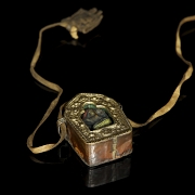 Amuleto de bronce