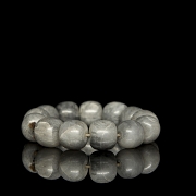 Bracelet with thirteen greyish jade beads, 20th century