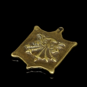 Amuleto de bronce
