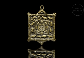 Amuleto de bronce