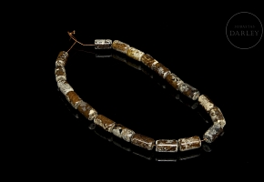 Necklace with twenty carved stone beads, Han style.