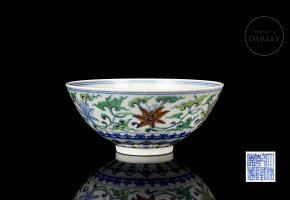 Porcelain bowl with doucai enamels, ‘Flowers’, with Qianlong seal
