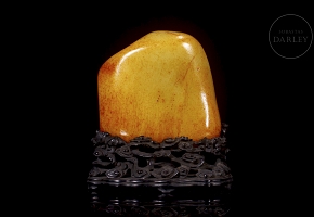 Large carved Hetian jade with wooden base, 20th century