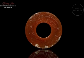 Carved red agate disc, Zhou dynasty