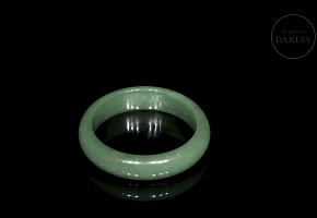 Rigid green jade bangle, 20th century