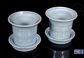 Pair of porcelain flower pots with sky blue glaze, marked Qianglong