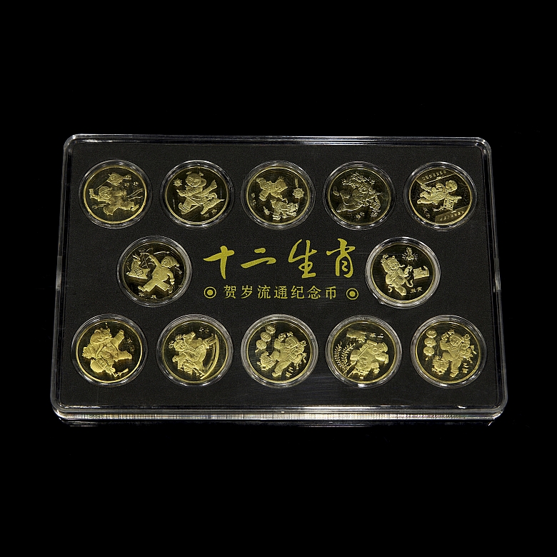 Juego de doce de monedas conmemorativas
