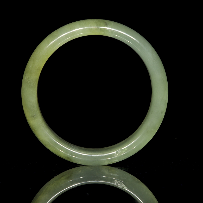 Circular carved jade bangle, 20th century