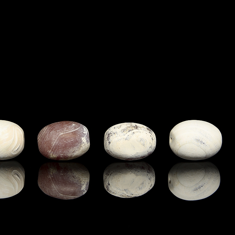 Four large carved stone beads, Qing dynasty