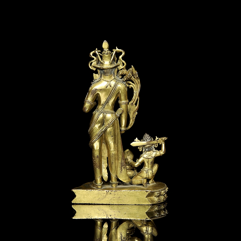 Grupo escultórico de bronce dorado 