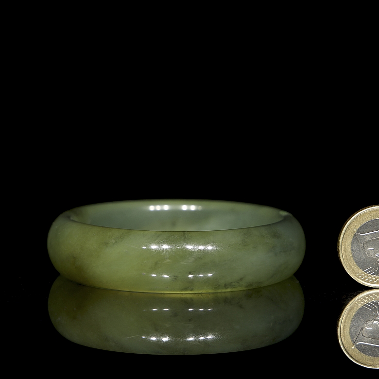 Circular carved jade bangle, 20th century