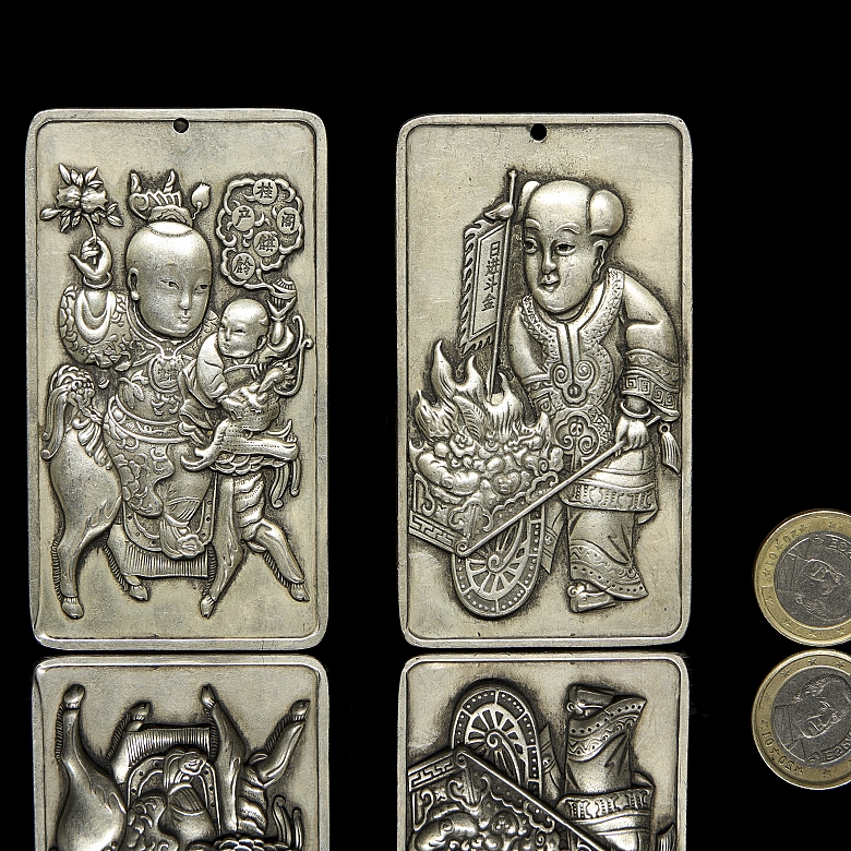 Pair of silver metal plaques, ‘Characters’, 20th century