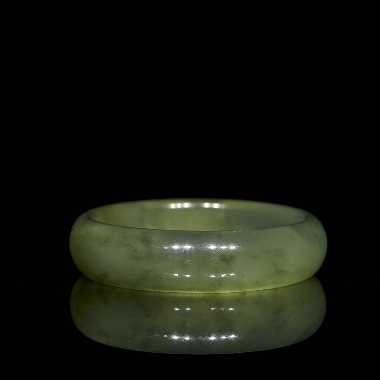 Circular carved jade bangle, 20th century