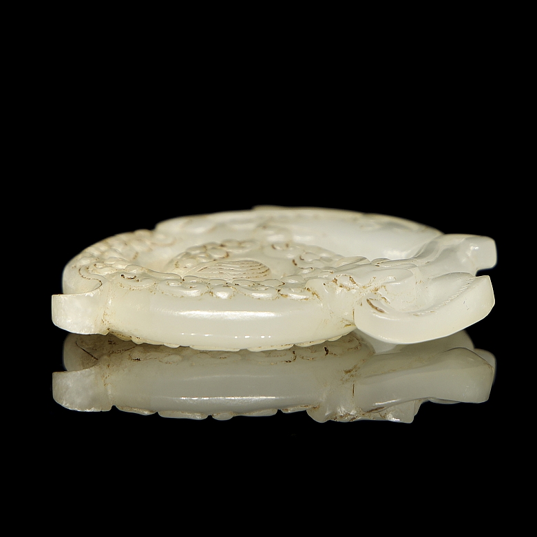 Carved white jade pendant “Dragon,” Han dynasty