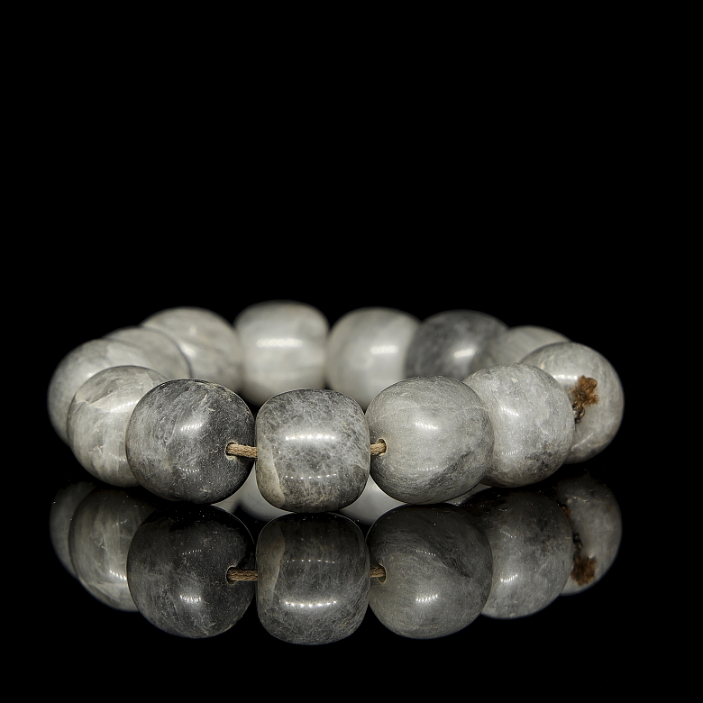 Bracelet with thirteen greyish jade beads, 20th century