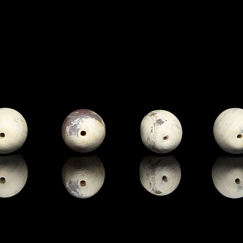 Four large carved stone beads, Qing dynasty