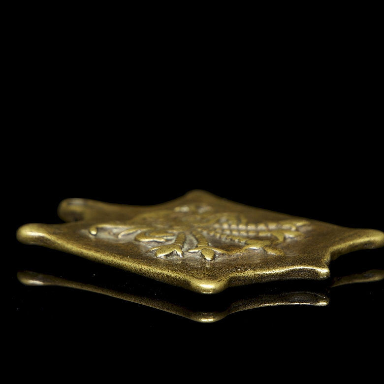 Amuleto de bronce
