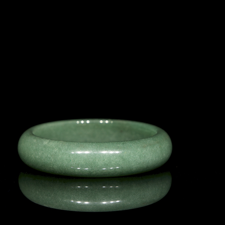 Rigid green jade bangle, 20th century
