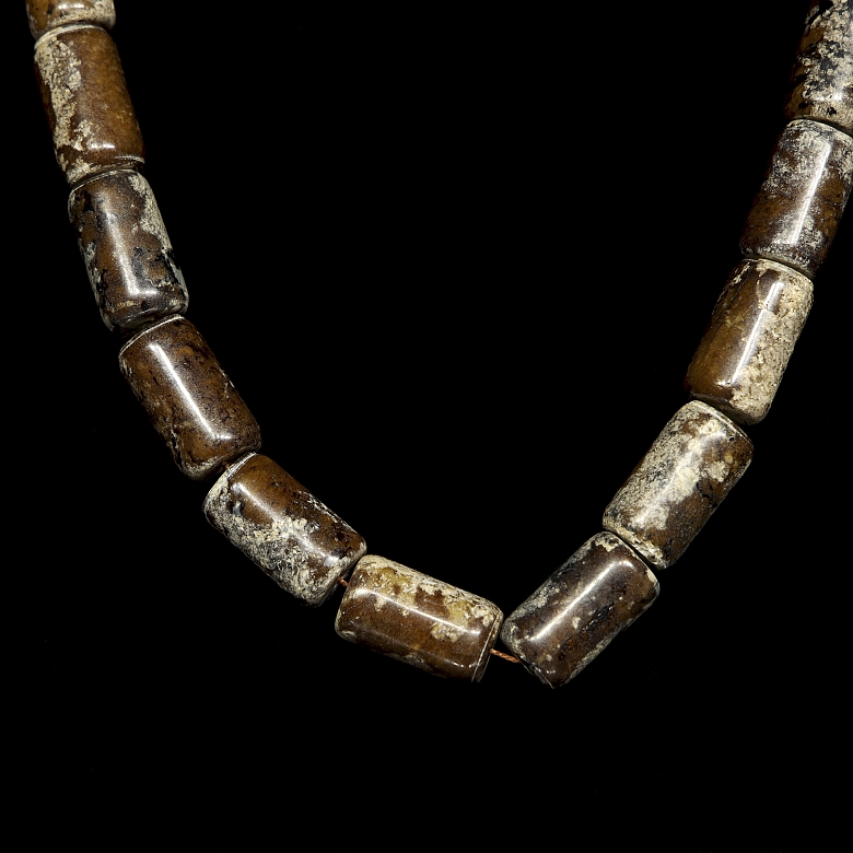 Necklace with twenty carved stone beads, Han style.