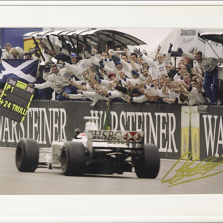 Photograph signed by Johnny Herbert celebrating victory, 1999 - 1