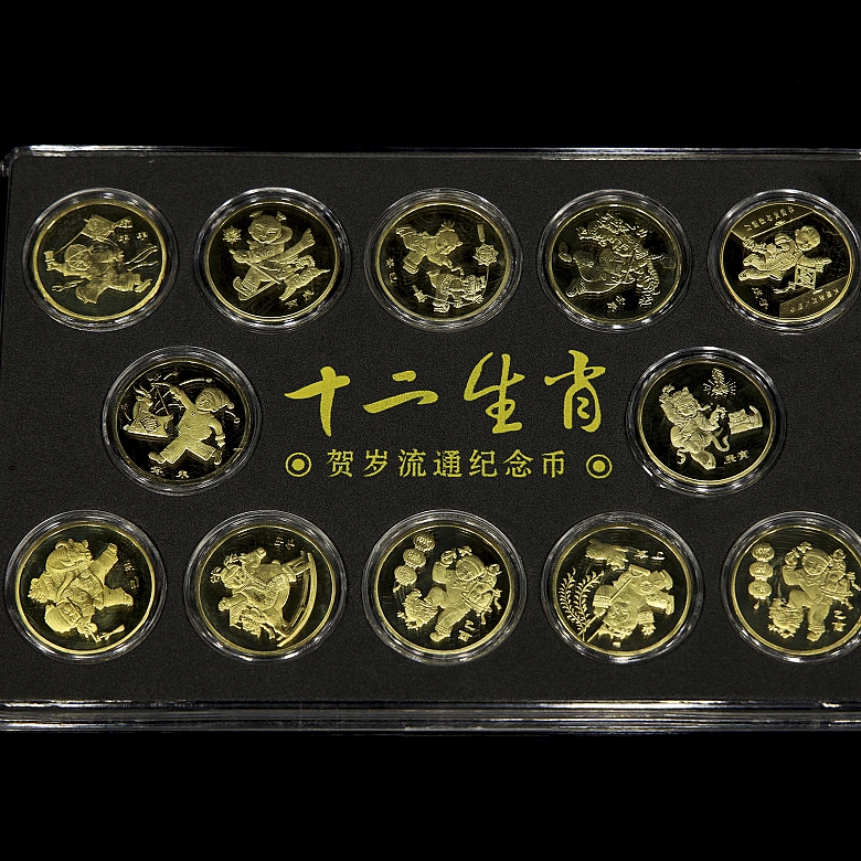 Juego de doce de monedas conmemorativas